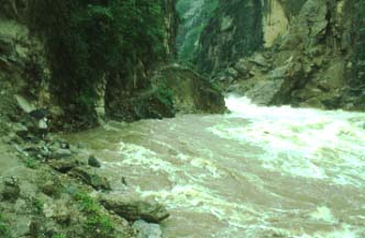 Monsoon-swollen Pula River blocks trail to Dong Shao Fang